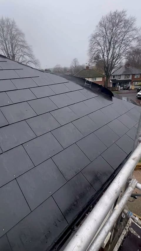 Finished slate roof with neat, even courses and new edge trim