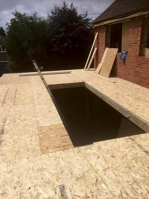Boarded extension roof with an opening framed for a roof lantern