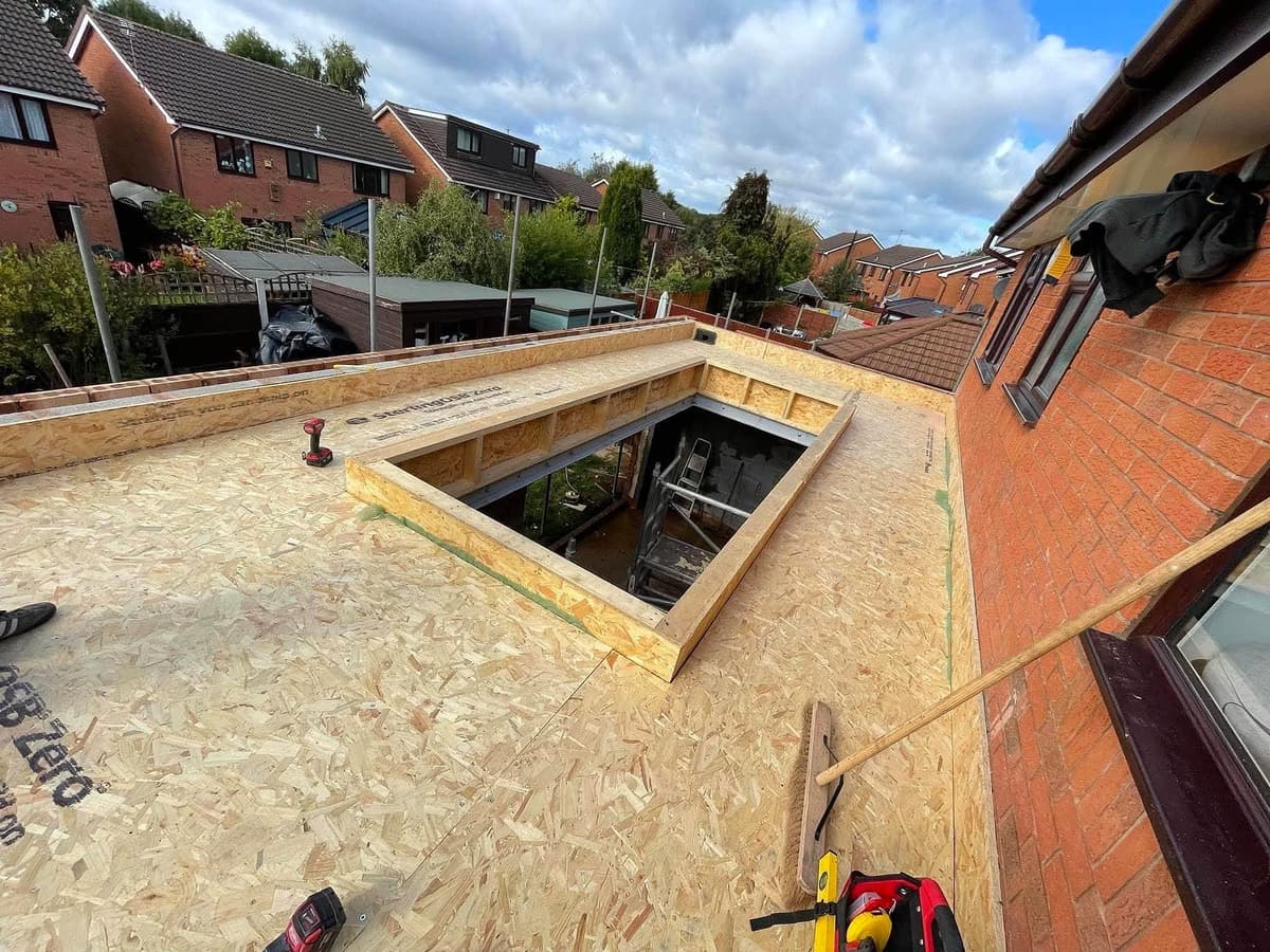 New timber deck on a flat roof with a raised upstand for a roof lantern