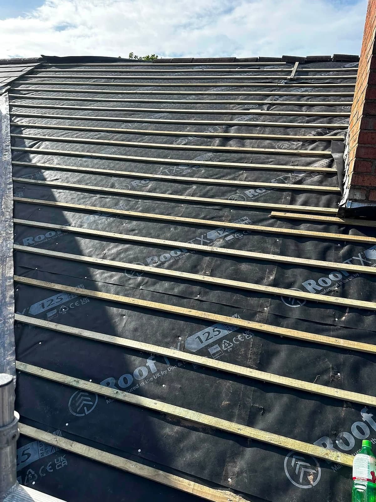 New breathable membrane and battens fitted where old slates were removed